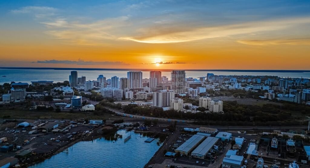 Drone/Ariel shot overlooking Darwin CBD from the see with the sunset in the background behind the city. This pictures showcases Drone Shots.